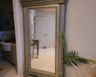 Very large free standing vanity mirror.