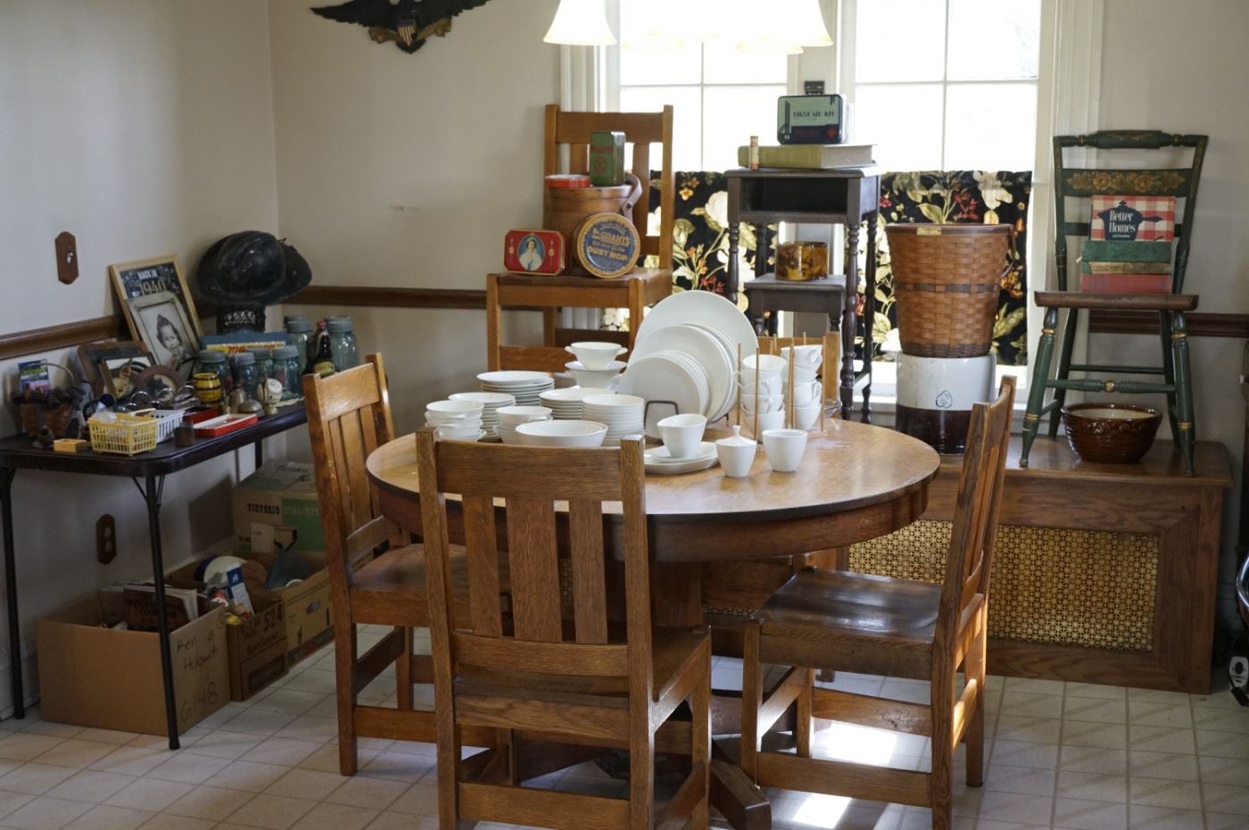 Round oak table w/4 chairs, Hitchcock chair, vintage pipes, vintage tins, banks, cookbooks, crocks, Longaberger basket, Arzberg dinnerware