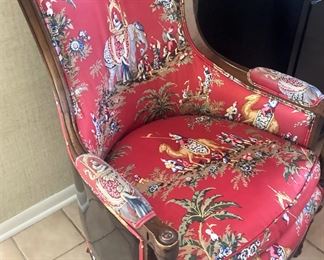 One of two matching Asian print upholstered chairs