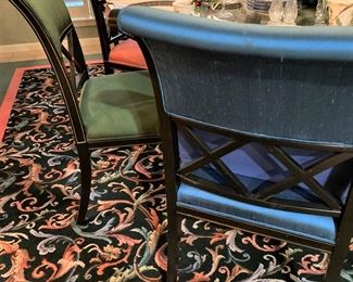 The chairs are upholstered as pairs in bright colored fabric.