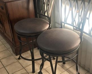 Two of four matching metal bar stools
