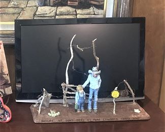 Small TV; art "We don't need no more cowboys, that's why" by Gene Zesch - This was acquired in 2009 from Whistle Pik Gallery in Fredericksburg, Texas.