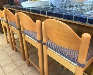 Four matching wooden bar stools