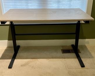 Sleek desk - manually raise up and down