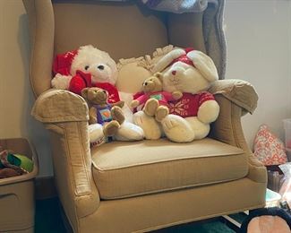 Stuffed Animals on Cream Armchair 