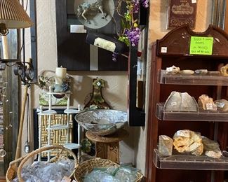 Bronze treasure horse decoration in a 3-D frame, lots of rocks, geodes, amethyst and a piece or two of petrified wood. Also have crystal chandelier prisms and bulbs and teardrops.