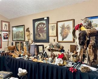 Several carved wooden bowls, vases, burlwood and teak wood pieces, fur pelts, hat and muff, Kaiser cowboy original painting, Jay Weaver wagon wheel painting