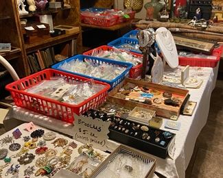 Several flats of costume jewelry along with some finer jewelry pieces