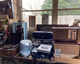 Vintage electronics mixed in with other misc kitchenware and household decor