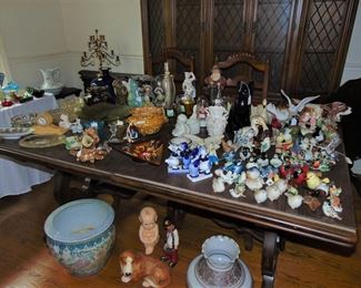 Porcelain, ceramic and glass items just unpacked. China cabinet in the background.  (Items sold separately)