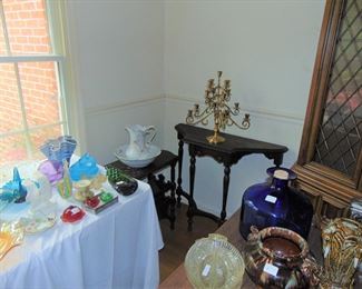 Small tables, pitcher and bowl, candelabra, and art and depression glass (Items sold separately)