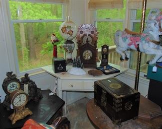 and more clocks, corner table, Asian chest, and 4th carousel horse, (Items sold separately)