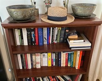 Another bookcase is shown here, along with the books and a pair of decorative bowls on top.