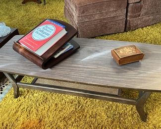 This coffee table definitely has some style. There is also a book stand under the dictionary.