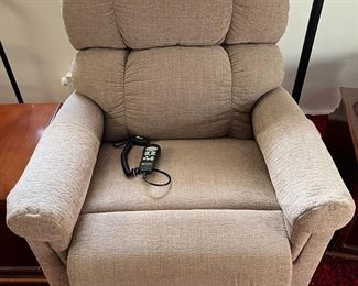 This is an electric lift chair that is in good condition.
