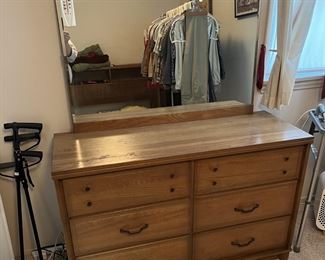 Another dresser, this time with a mirror, is here. Look at the reflection for the clothes rack.
