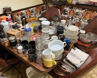 There is a fair collection of mugs, glassware, bowls, and more.