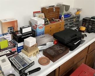 Also in this room are a number of little drawer sets, both wooden and plastic. The bottom right shows the corner of a toolbox.