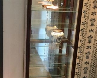 Howard Miller Collectors Cabinet - Lighted w/ Glass Shelving