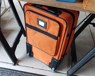 Orange suitcase luggage