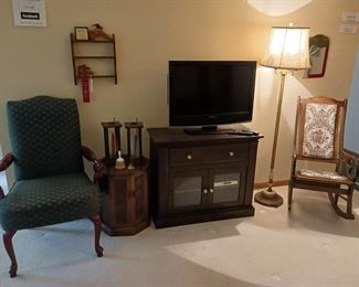 Flat screen television antique rocking chair