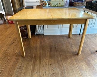 Farm table with self storing leaf