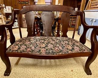 Tapestry covered loveseat