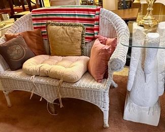 White wicker loveseat.