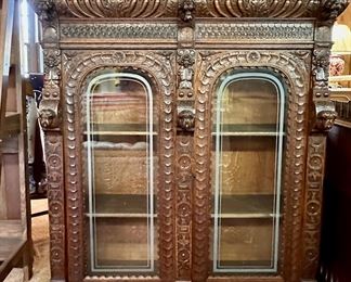 Wonderful hand carved walnut book case.  Matching base in next picture.  Together stands over eight feet tall.