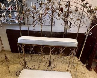 Floor standing brass candelabras.  Brass framed prayer bench.