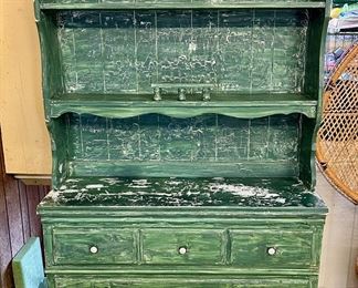 Distressed green hutch.