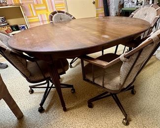 Oval dining table and four chairs.