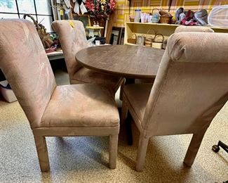 Round (42") dining table and four parsons chairs.