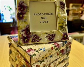 Dozens of this small porcelain picture frame in unopened boxes available.