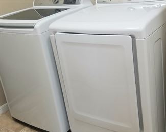 Close up of Samsung washer and dryer, very clean, washer is a top loader