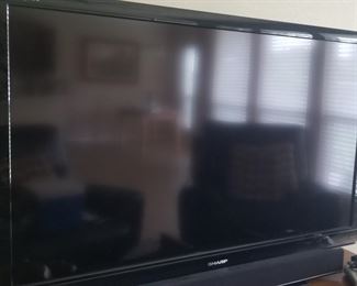 Large Samsung TV and Vizio sound box, sold separately 
