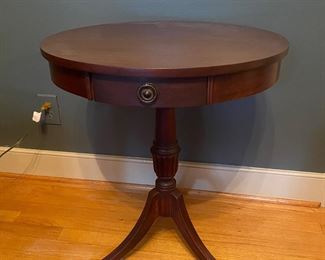F2 - $40. Single Drawer Round Side Table. Measures 22" across x 26.5" Tall. 