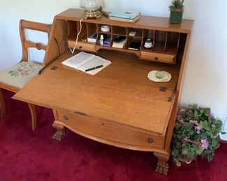 F31 - $225 Claw foot solid wood drop front desk. Measures 18" deep x 37.5" wide x 39" tall. 