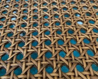 F42 - $95 Oversized wicker arm chair with caning. Measures 30" wide x 40.5" tall. 