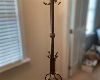 F24 - $75 Brass Coat Rack. Measures 18" wide x 70.5" tall. 