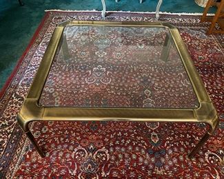 F39 $1300 - Mastercraft Brass & Glass Coffee Table waterfall legs. Measures 39.5" square x 16" tall. 