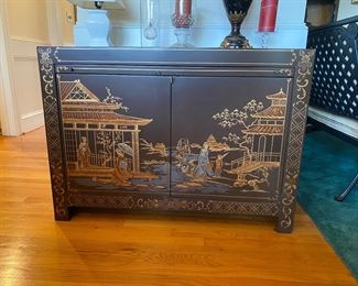 F47 - $400. Lacquered Asian Art Liquor Cabinet. Measures 18.5" x 41" wide x 29.5" tall. 