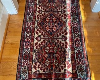 F51 - $50. Runner rug with reds & blues. 