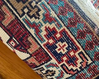 F51 - $50. Runner rug with reds & blues. 