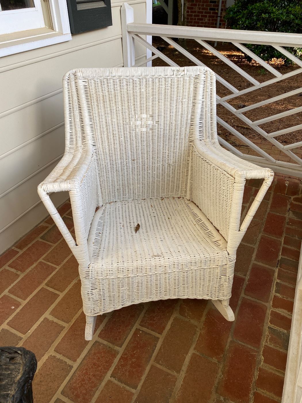 F58 - $150 - Single White Wicker Rocker.  Has been stored inside. 