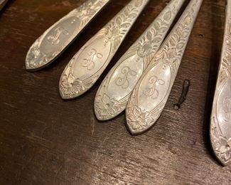 S1 - $1125. Small Set of Monogrammed "L" S. Kirk Sterling. 6 Knives. 4 soup spoons. 12 teaspoons. 6 Salad forks. 6 dinner forks1050 grams + 3 oz for knives.  4 Serving pieces 274 grams. 