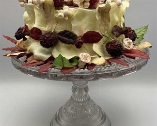 Lot 294 | DECORATIVE SILK FLOWER CAKE DISPLAY ON PRESSED
