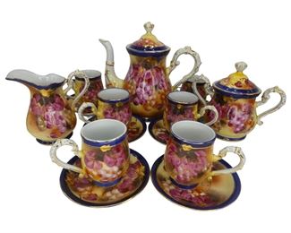 Service for 6 includes one 9" teapot, one 6.5" sugar jar, one 5.25" creamer cup, 6 x 3.5" mugs, and 6 x 5.25" saucers. Immaculate and very rare.
