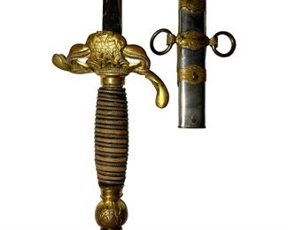 This is a 19ths century ceremonial sword made by Henederson Ames Co in Kalamazoo Michigan. Appriased at up to $400. The blade is engraved with the name of the recipient, C.H. Sansone. The nickel-plated iron scabbard is adorned with two gilt and chiseled brass bail bracelets. The first, with double rings, bears the mention Paxaut Bellum, the second with single ring, appears the monogram PM referring to the initials of the Militant Patriarchs. The sword dates from the late 19th century to early 20th century.