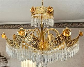 Based on the shapes and design of this chandelier it is from the Art Nouveau era 1890-1914. It has an approximate value of $12,000-$14,000 full retail. The above information is assumed accurate from the appraiser. Full authentication in Denver is available for an additional fee.